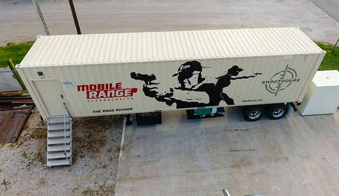 Aerial view of Road Runner mobile shooting range trailer with entry stairs