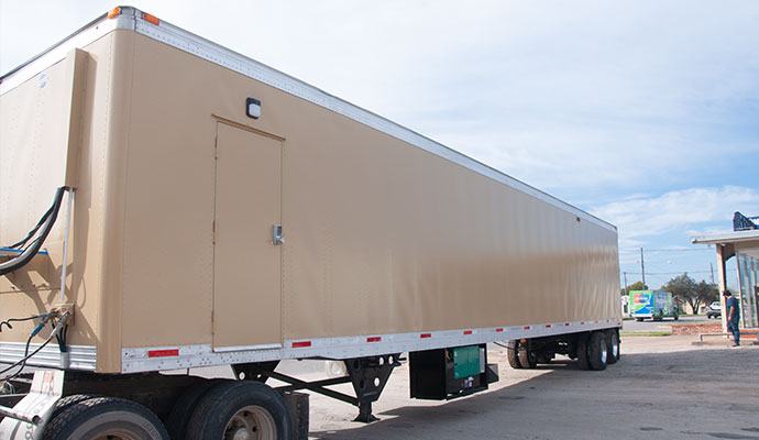 Government agency mobile shooting range trailer parked on facility grounds