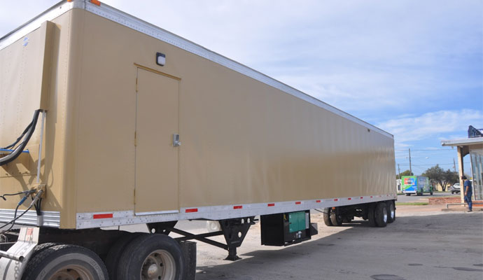 Enclosed van trailer configured as a mobile shooting range