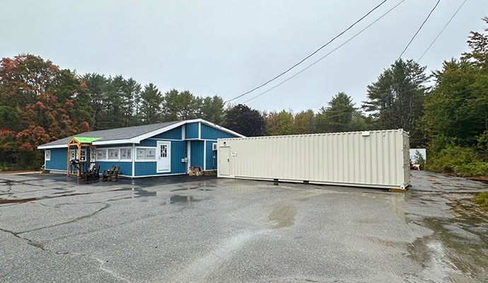 Modular container shooting range installed outside a commercial building