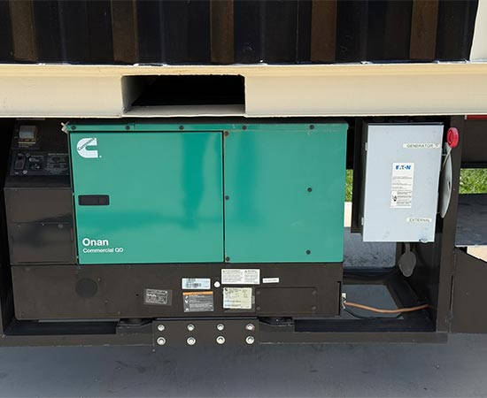 Cummins Onan Commercial QD generator mounted underneath a mobile container structure