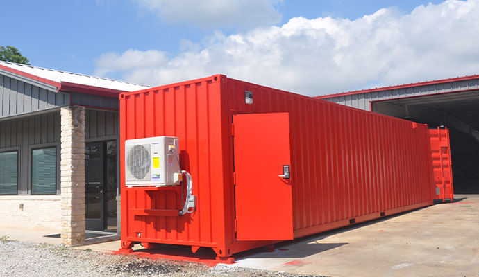 A red 40' Groundhog base configuration container range