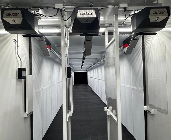 A view looking down the length of the interior firing lane of a 25-yard mobile shooting range