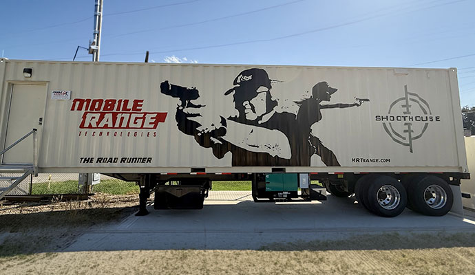 Road Runner shoothouse mobile shooting range trailer parked on concrete pad