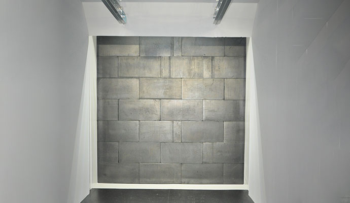 Close-up of a rubber block wall treatment installed inside a shooting range lane