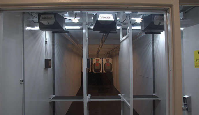 Three-lane indoor shooting range with Caliber target retrieval system and silhouette targets